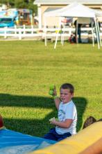 Young member at inflatable game